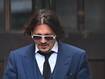 US actor Johnny Depp leaves the Royal Courts of Justice in London. Depp is suing The Sun's newspaper publisher News Group Newspapers (NGN) over claims he abused his ex-wife, US actress Amber Heard.